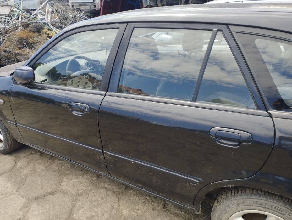 Mazda 323f lift zderzak przód tył klapa tylna maska czarne reflektor lampa