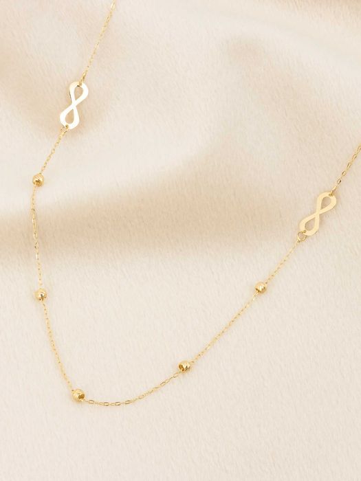 Złoty naszyjnik celebrytka 585 nieskończoność i diamentowane kulki