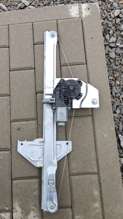 Podnośnik mechanizm szyby lewy  Berlingo partner 08-18