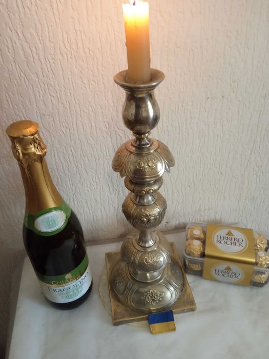 Посеребренный  подсвечник, высота 36 см.  Старина.