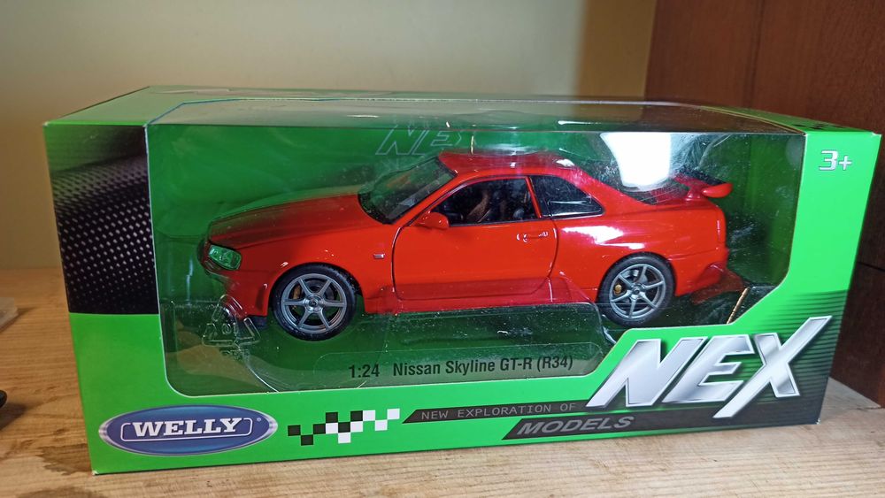 Колекційна модель автомобіля Welly Nissan Skyline GT-R (R34) у масштабі 1:24