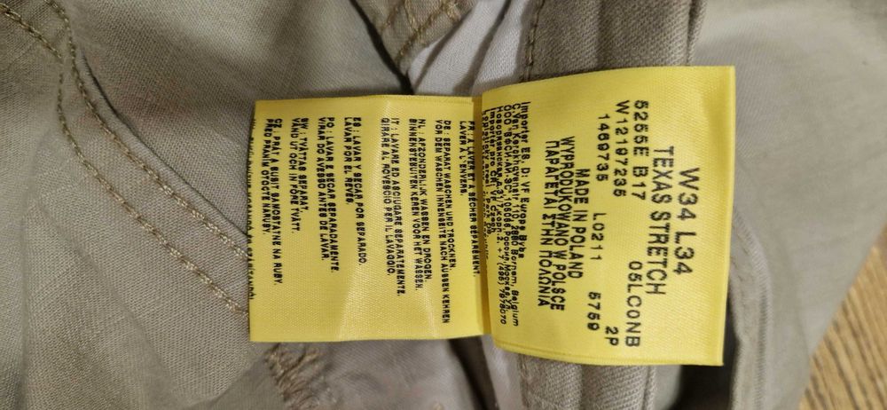 Beżowe Spodnie męskie jeans Wrangler Texas Stretch W34L34