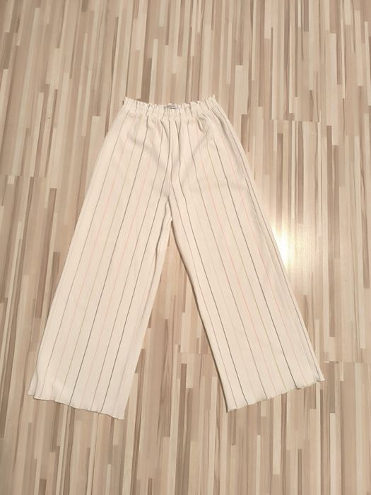 Spodnie białe szerokie Reserved 140