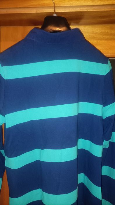 Polo Quebramar com fecho, apontamentos laranja
