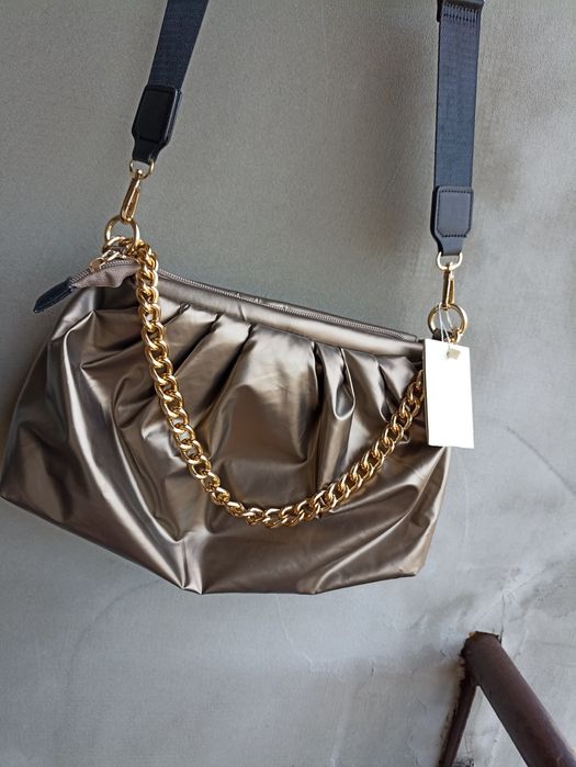 Miedziana złota z łańcuszkiem torebka i inne