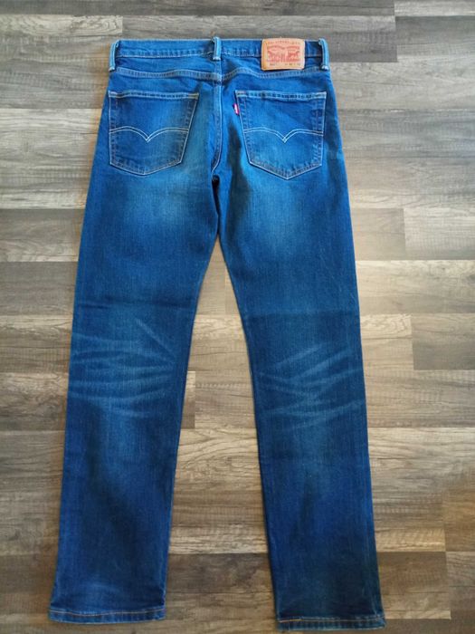 świetne spodnie Levi"s 502 31/32 w super stanie