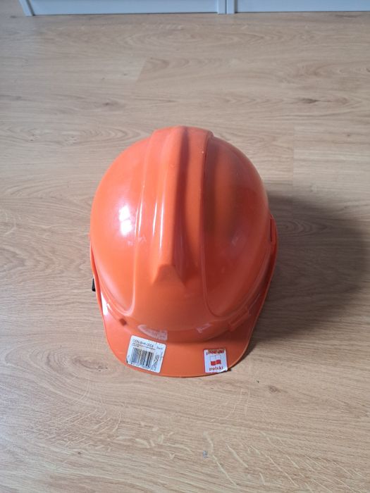 Kask budowlany pomarańczowy z uchwytem regulowany