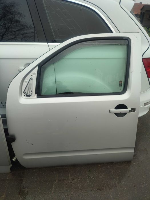 Drzwi lewy przód Nissan Pathfinder R51 srebrne