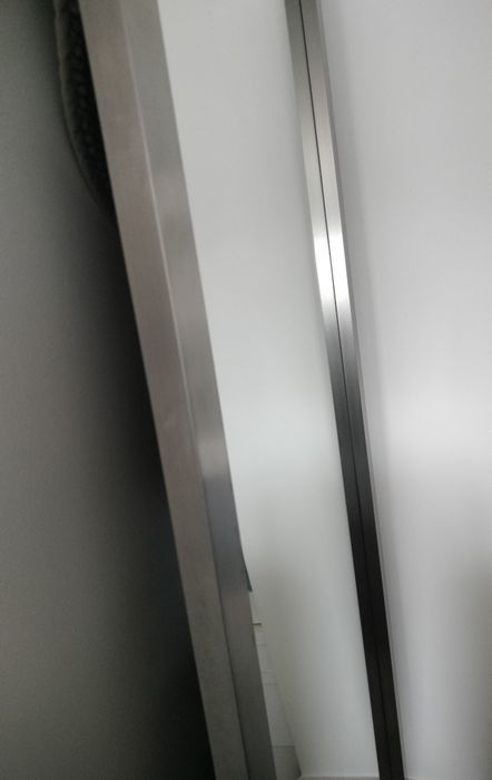 Espelho com moldura em inox