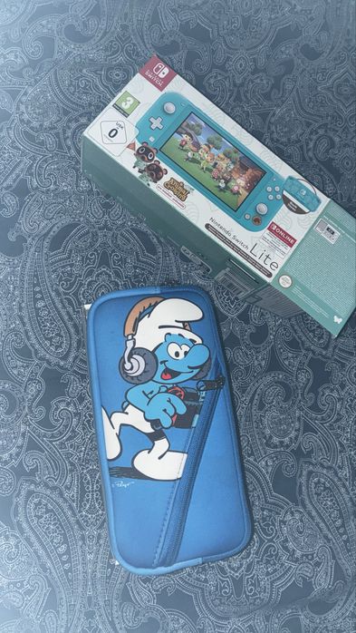 Consola Nintendo Switch lite turquesa com mala
