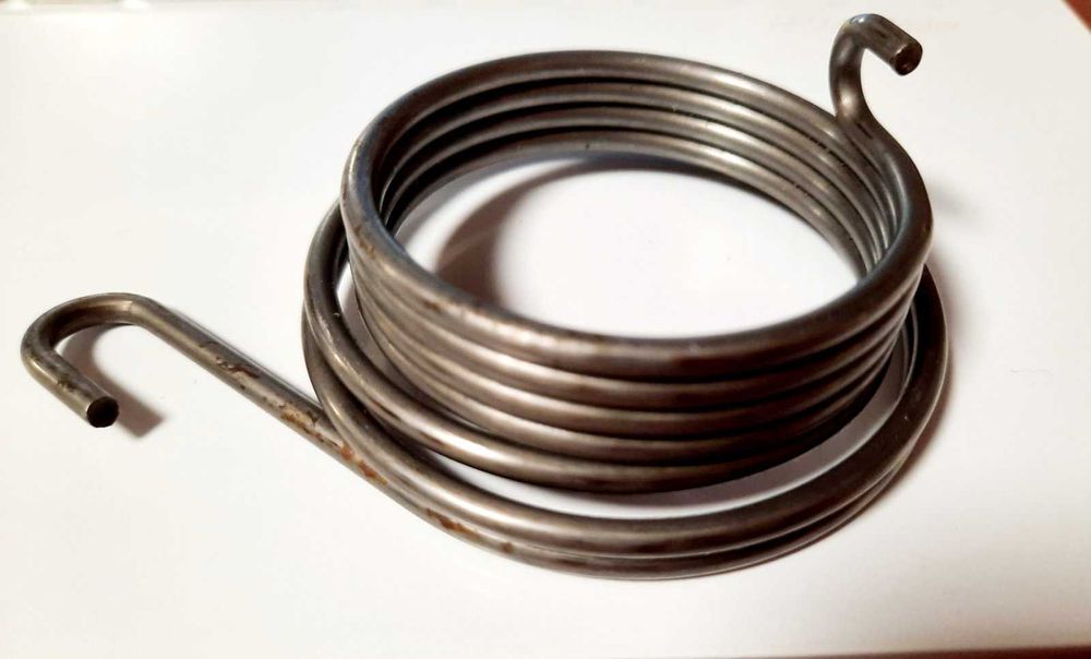 Поворотна пружина валу