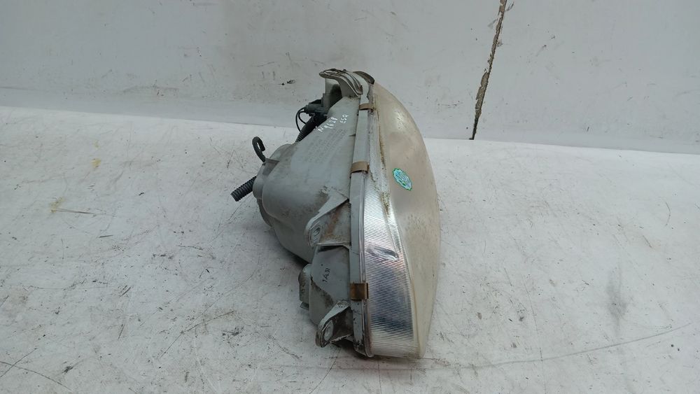 Ótica / farol esquerda KIA Carnival II (GQ)