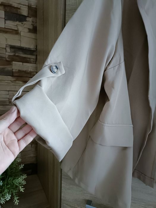 Beżowy żakiet narzutka bez guzików plus size