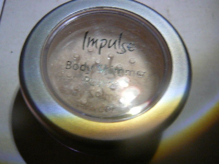 puder rozświetlający Impulse Body Shimmer ,szminka Rimmel +kosmetyczka
