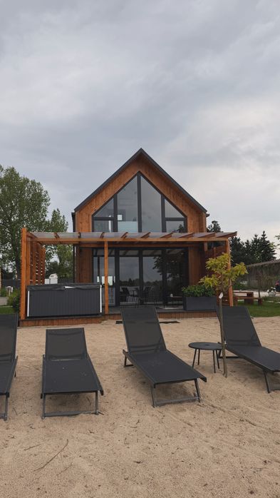 Domek Domki Kunice  z własnym Jakuzzi nad jeziorem prywatną plażą