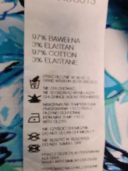 Turkusowa sukienka w kwiaty marki Quiosque rozmiar 42