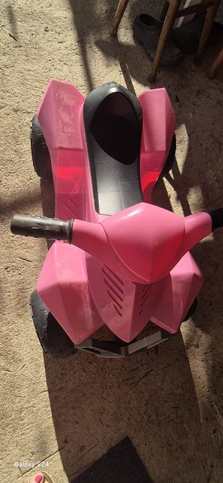 Moto rosa criança