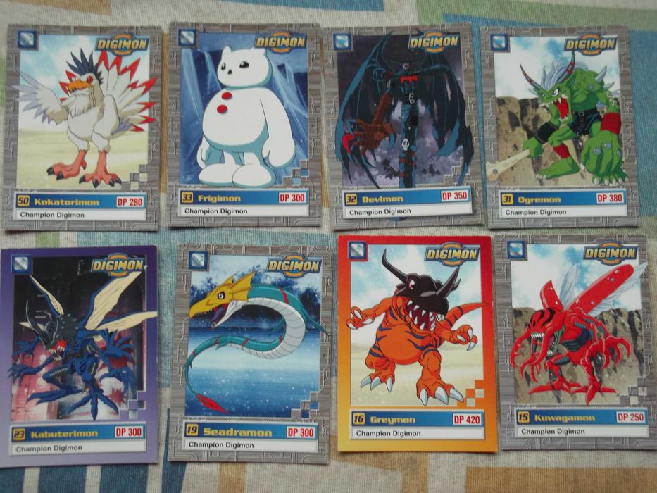 (D) Cartas da Pokémon e Digimon