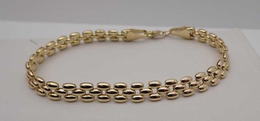 Złota bransoletka pękate ozdoby 19 cm. 6,4 mm.