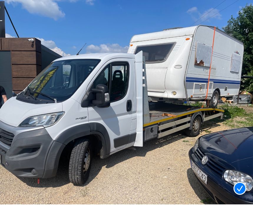 Pomoc drogowa Holowanie Transport osobowych i towarów Autolaweta