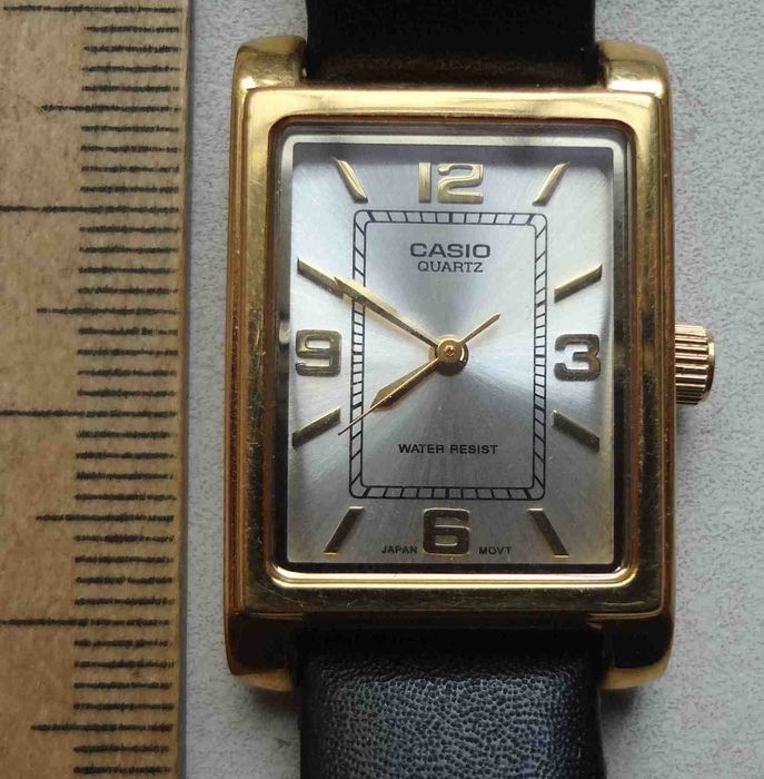 женские наручные часы Casio LTP-1234  с золотистым корпусом и браслетом