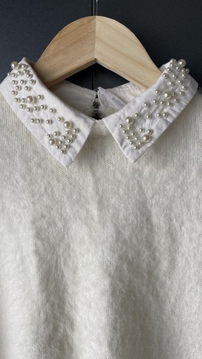 Білий светр з бусинами