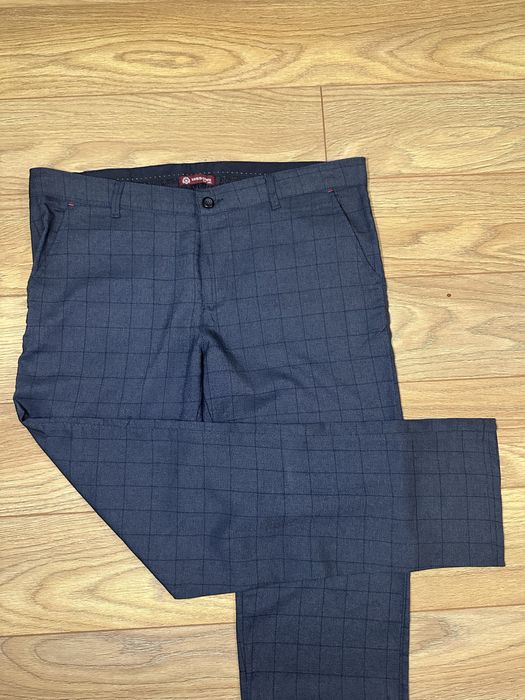 Брюки класичні в клітинку синього коліру