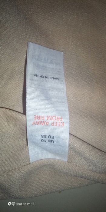 Sukienka W panterkę z cekinami