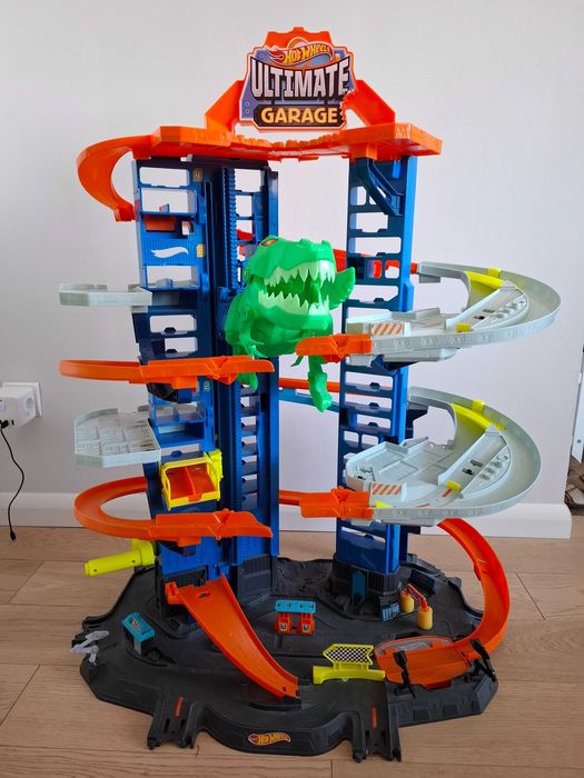Hot Wheels City GJL14 Mega Garaż Atak Dinozaura T-Rex + gratis