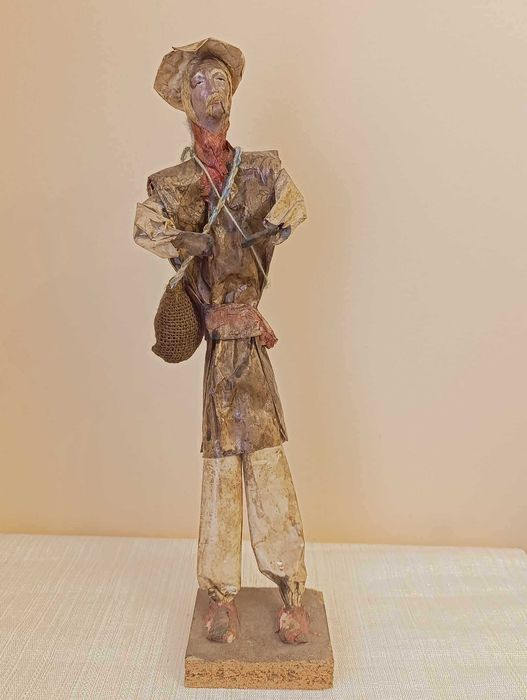 Handcrafted male figure with bag and gourd, papier-mâché