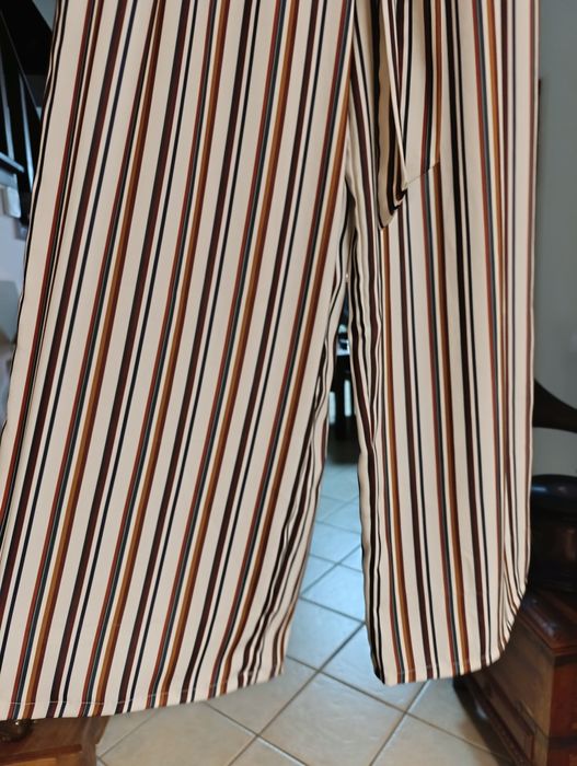 Calças fluidas, de pernas largas,muito elegantes
