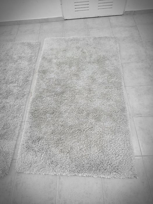 2 tapetes creme de 160x85 cms