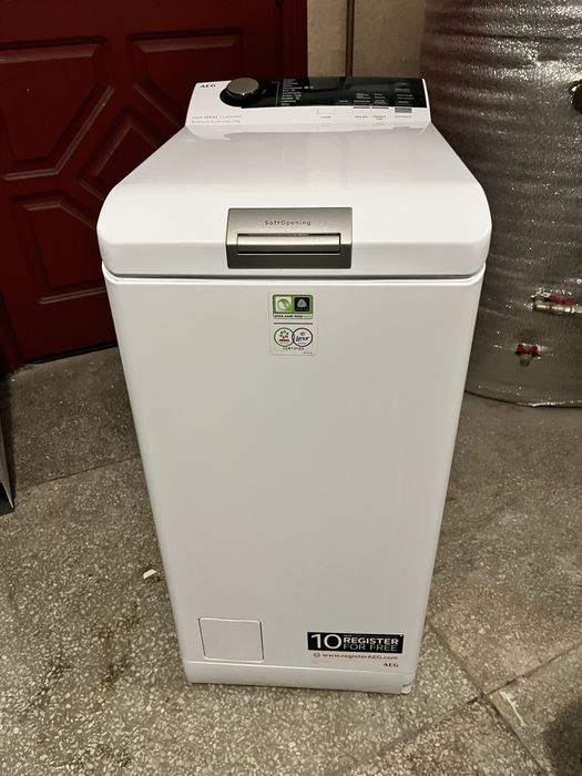 Вертикальна пральна машина AEG 7000 Series 1-7 кг
