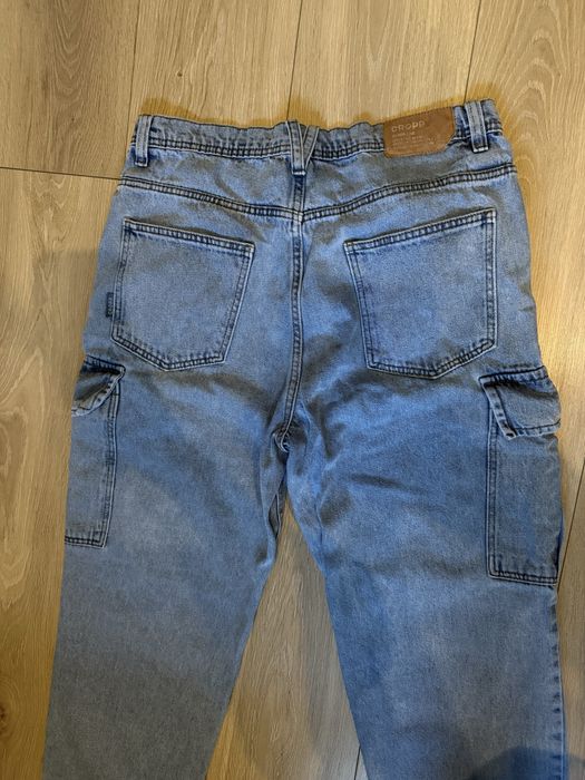 Spodnie jeansowe niebieskie  loose 34/32 cropp