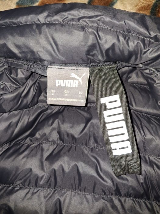 Чоловічий пуховий жилет