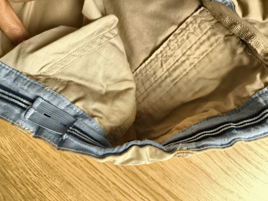 Kremowe eleganckie spodnie chłopięce Lindex, rozmiar 164