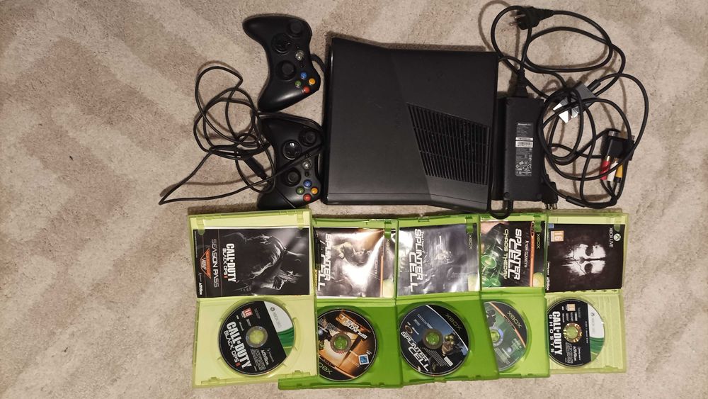 Xbox 360 with controllers, cables, and games64751976569089121