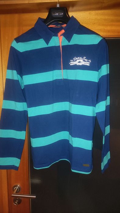 Polo Quebramar com fecho, apontamentos laranja