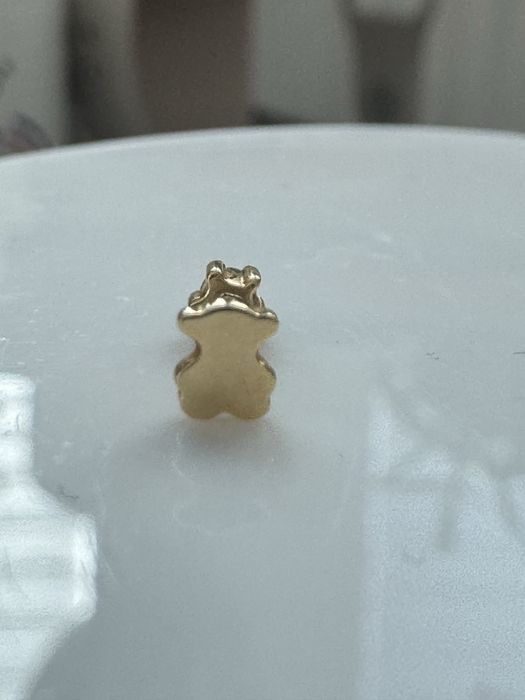 Złoty kolczyk (piercing) Tous