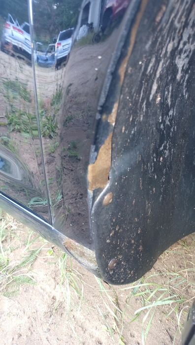 Błotnik prawy Touran l czarny przedlift