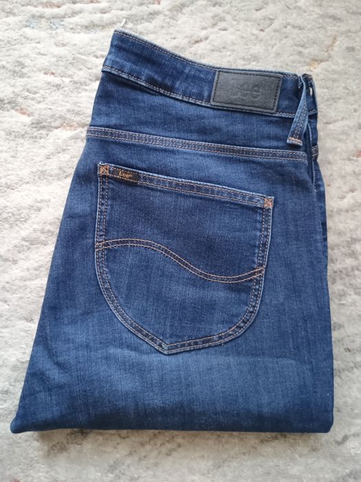 Piękne skiny jeansy LEE Scarlett High W 32 L31 w pasie 82 cm