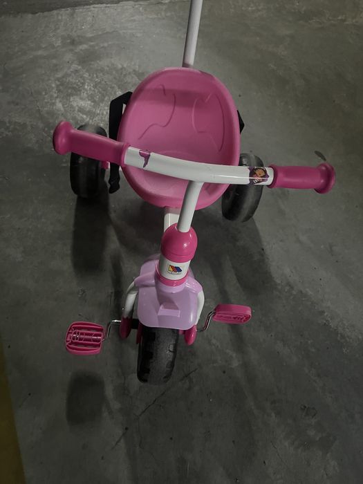 Triciclo rosa usado