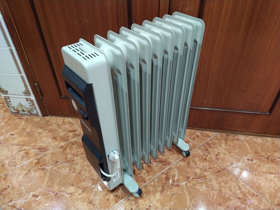 Aquecedor radiador a óleo  casa quarto apartamento vivenda escritório gabinete cozinha.