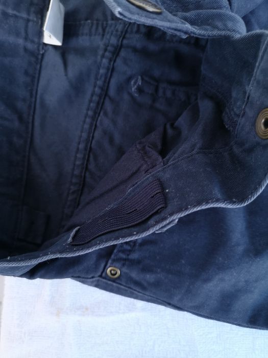 Granatowe eleganckie materiałowe regulowane spodnie h&m 134