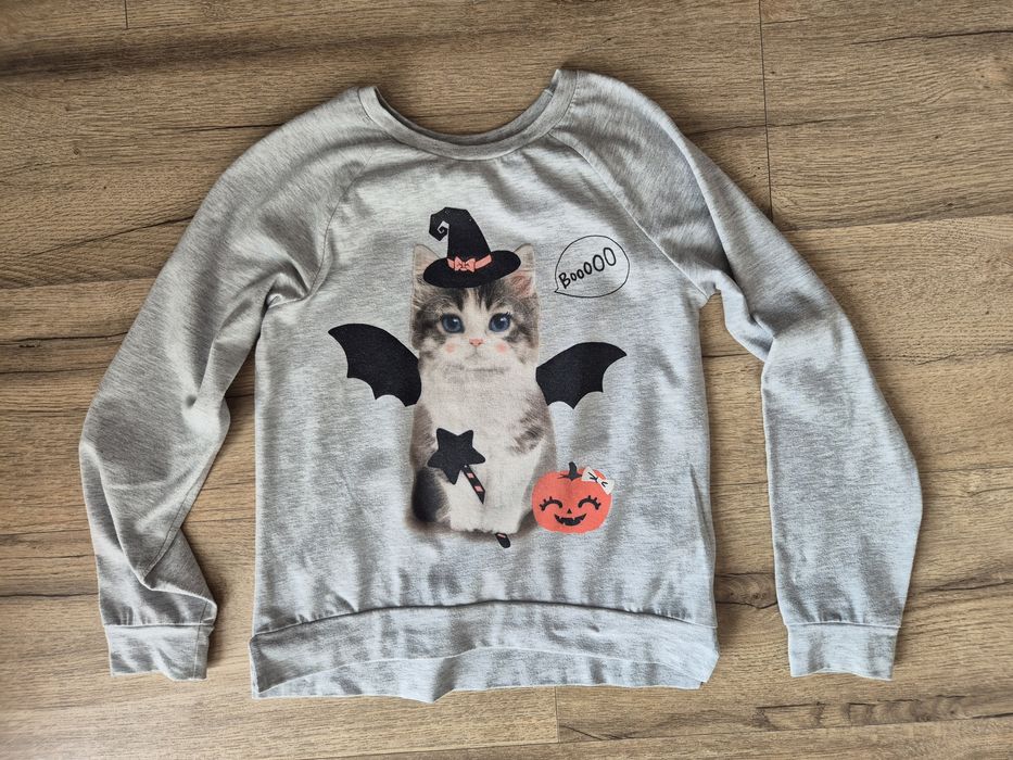 Bluza H&m halloween 122/128
Normalne ślady użytkowania I prania