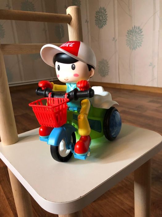 Музыкальная игрушка Мальчик на мотоцикле