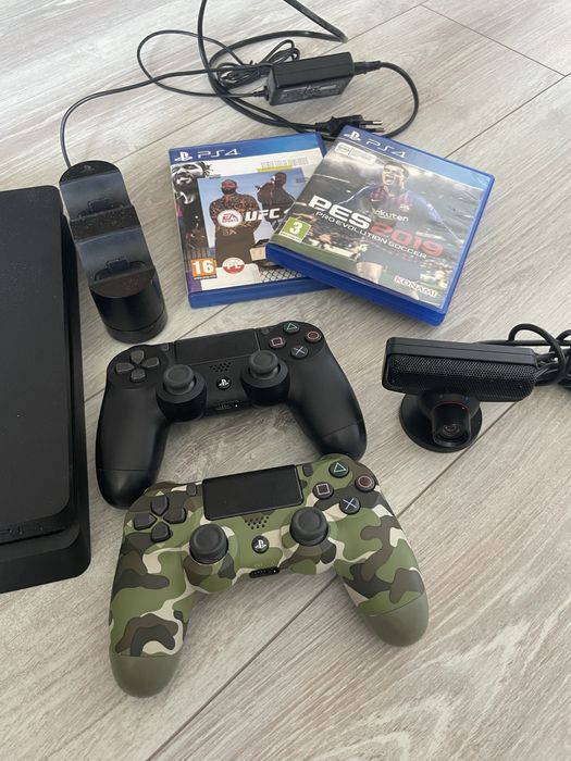PlayStation 4 Slim 1TB + 2 pady + stacja ładująca + 2 gry + kamerka PS Eye