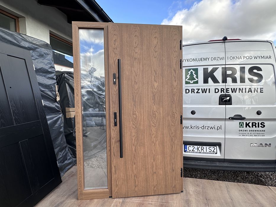 Drzwi zewnętrzne drewniane dębowe z doświetlem i antabą montaz Polska