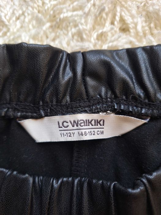 Штани з еко-шкіри для дівчинки на 11 років.