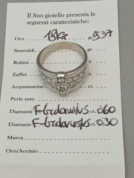 Złoty pierścionek z brylantami 18 k 9,40 g